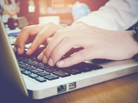 Business people using laptop on wood tableの写真素材