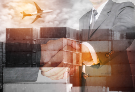 Double exposure two businessman hands shake with container and air plane ,business logistick concept.の写真素材