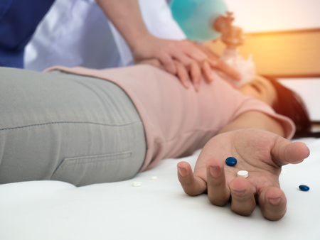 First Aid - Doctors are helping young women with CPR in cases of heart failure due to overdose.の写真素材