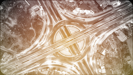 Top view over the highway at night, Aerial view interchange of a city, Shot from drone, Expressway...