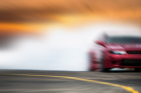 Abstract blurred car wheel drifting and smoking on track. Sport car drift concept.の写真素材