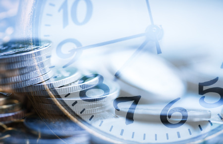Double exposure blurry coin with clock background investment and financial concept.