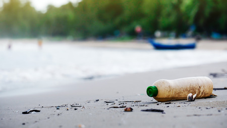 Trash from the dumping of tourists on the beach. Pollution concept.の写真素材