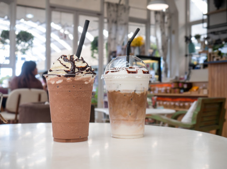 Latte frappe, chocolate frappe on white table at coffee shop.の写真素材
