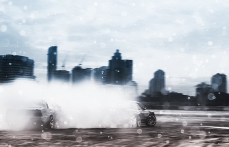 Sport car wheel drifting. Blurred of image diffusion race drift car with lots of smoke from burning tires on speed track. Sport concept,Drifting car conceptの写真素材