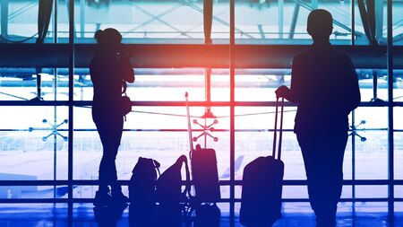 Two passengers waiting to transit flight at the airport.の写真素材