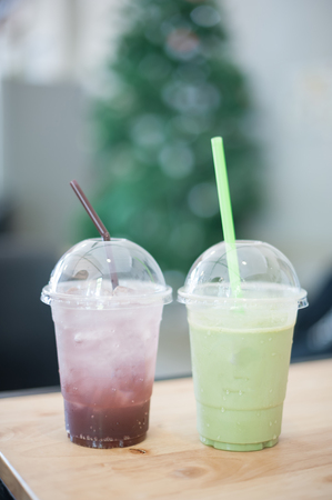 A glass of blueberry soda and green teaの写真素材