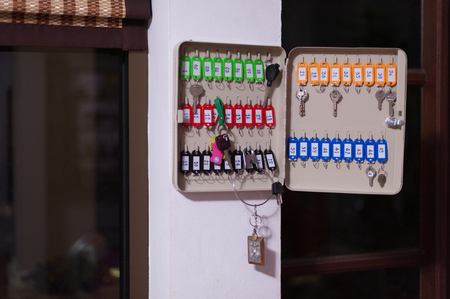 Many keys hanged on a key storageの写真素材