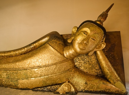 An ancient reclining buddha in Wat Pa Pra Doo , Thailand の写真素材
