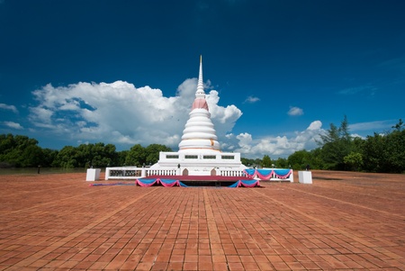 Pagoda under the blue sky with mangrove background in Thailandの写真素材