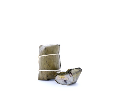 Kao Tom Mud, Thai dessert, steaming sticky rice filled with banana isolatedの写真素材