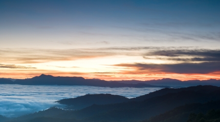 Romantic sunrise in fog valley, Chaing Dao mountain , Thailandの写真素材