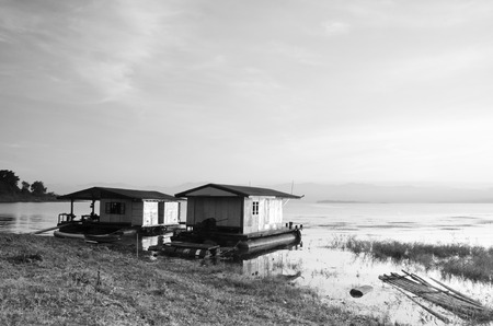 Sunrise over bamboo raft in Srinakarin National park, Thailandの写真素材