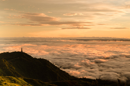 Dramatic sunrise over valley of fog a view from top of mountain, Thailandの写真素材