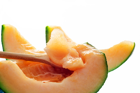 Fresh Cantaloupe melon slice on white backgroundの写真素材