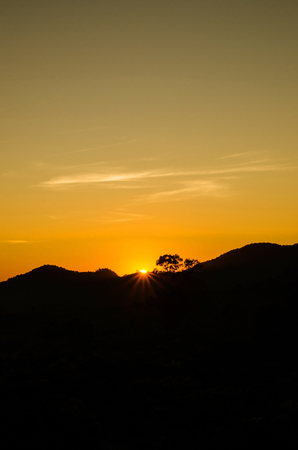 Dramatic sunset over mountain backgroundの写真素材