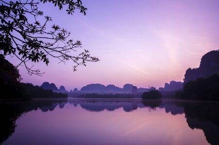 Amazing view of dramatic sunrise over Nong Tale Lake in Krabi, Thailandの写真素材