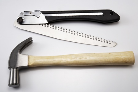 image of hammer and saw on white backgroundの写真素材