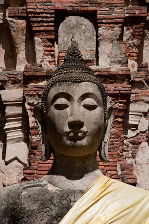 Image of Buddha in brick backgroundの写真素材