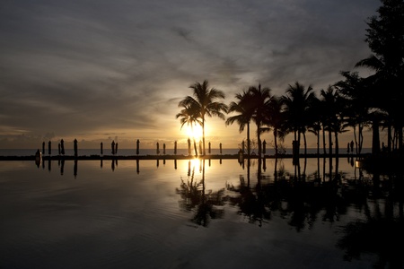 pool and sea in the morning sunset , beach of Thailandの写真素材