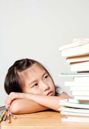 Girl is Tired for study  or with learning difficultyの写真素材