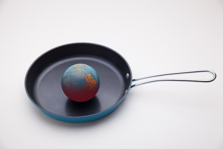 conceptual image of global warming on fried panの写真素材