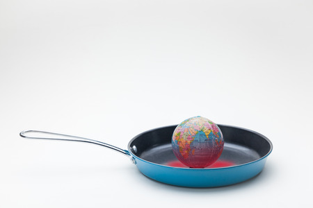 conceptual image of global warming on fried panの写真素材