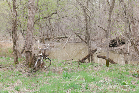be left bicycle junk  on the pondの写真素材