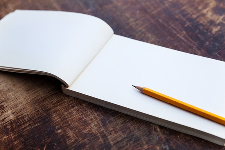 notepad on rustic wooden tableの写真素材