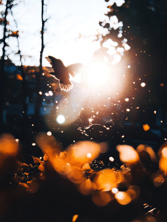 A mesmerizing bird soars through the air during a breathtaking sunset, capturing the essence of freedom and nature. Lush leaves create a warm atmosphere.の素材