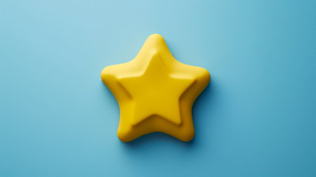 A bright yellow star shape set against a calming blue background, perfect for creative projects or educational materials. This vibrant image conveys joy and imagination.の素材