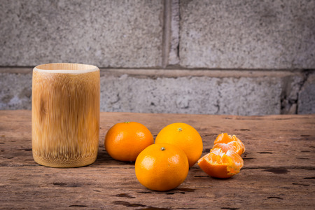 Orange on a wooden floor.の写真素材