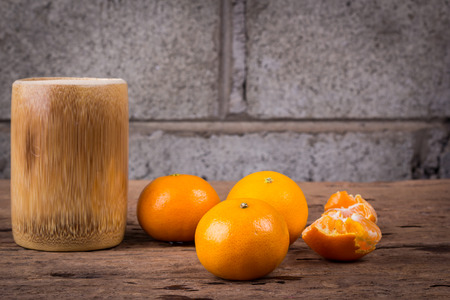 Orange on a wooden floor.の写真素材