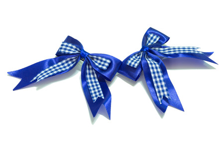Blue ribbon with bow on a white backgroundの写真素材