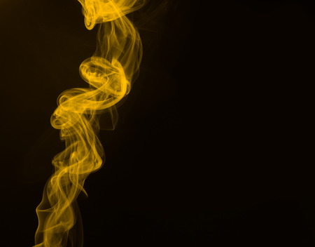 Fluffy Puffs of Smoke and Fog on Black Backgroundの写真素材