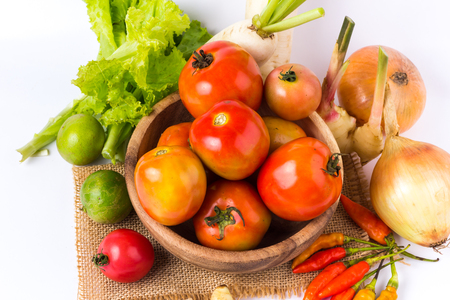 vegetable in wooden bowl on a white backgroundの写真素材