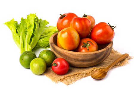 vegetable in wooden bowl on a white backgroundの写真素材