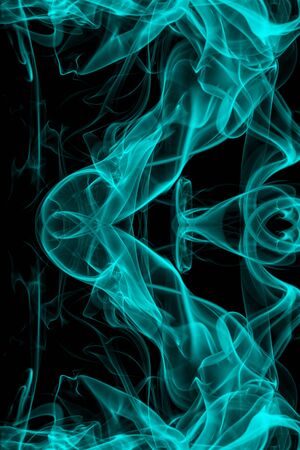 Blue smoke on black background, movement of white smokeの写真素材