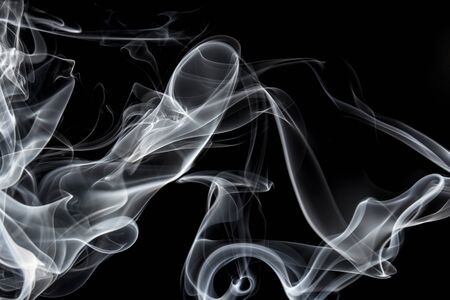 White smoke on black background, movement of white smokeの写真素材