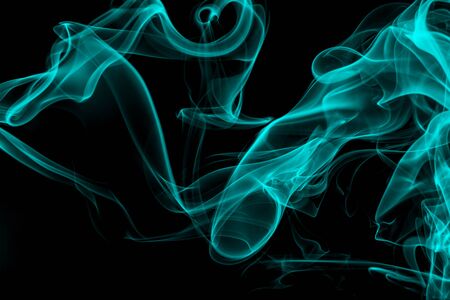 Blue smoke on black background, movement of white smokeの写真素材