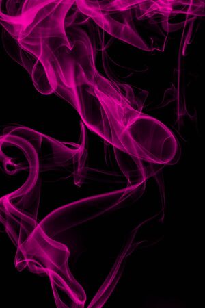 Pink smoke on black background, movement of white smokeの写真素材