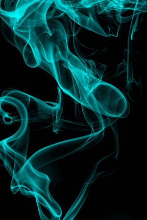 Blue smoke on black background, movement of white smokeの写真素材