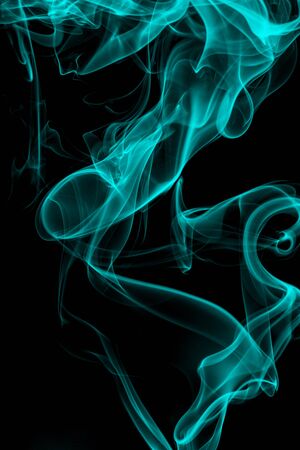 Blue smoke on black background, movement of white smokeの写真素材