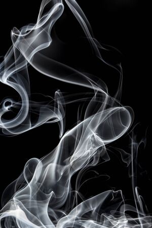White smoke on black background, movement of white smokeの写真素材