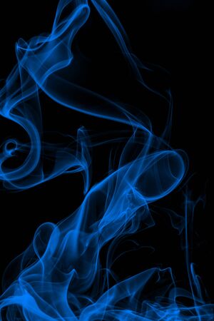 Blue smoke on black background, movement of white smokeの写真素材