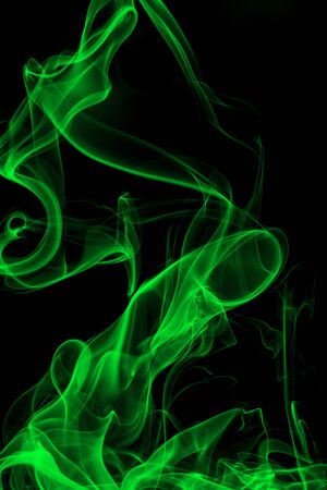 Green smoke on black background, movement of white smokeの写真素材