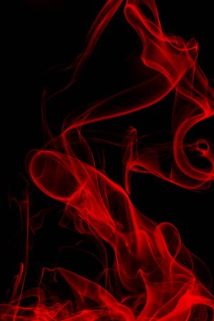 Red smoke on black background, movement of white smokeの写真素材