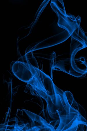Blue smoke on black background, movement of white smokeの写真素材