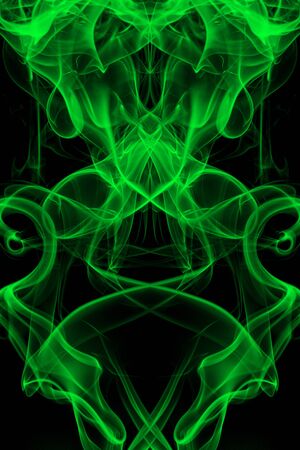 Green smoke on black background, movement of white smokeの写真素材