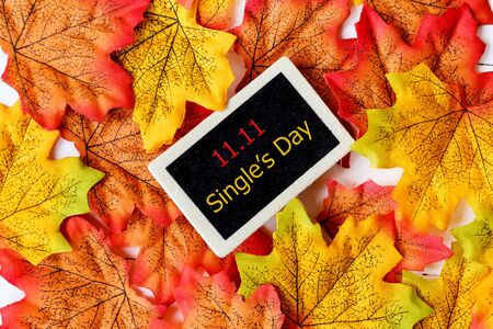 Online shopping of China, 11.11 single's day sale concept. Mini blackboard for text and maple leaf...
